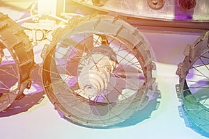 Mars rover wheels close up with light