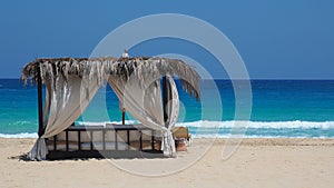 Marsa Matruh, Egypt. Elegant gazebo on the beach. Amazing sea with tropical blue, turquoise and green colors. Relaxing context