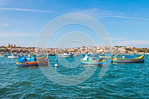 Marsaxlokk with Luzzu, traditional fishing boat from Malta islands