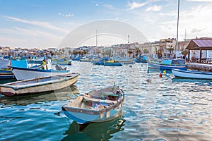 Marsaxlokk with Luzzu, traditional fishing boat from Malta islands