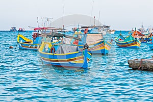 Marsaxlokk with Luzzu, traditional fishing boat from Malta islands