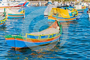 Marsaxlokk with Luzzu, traditional fishing boat from Malta islands