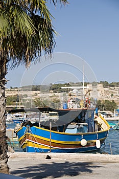 Marsaxlokk malta fishing village luzzu boat photo