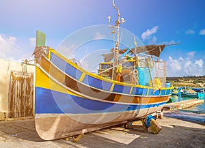 Marsaxlokk, Malta - Traditional Luzzu fisherboat at the famous market of Marsaxlokk
