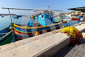 Marsaxlokk. Traditional boats Luzzu in the old harbor photo