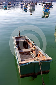 Marsaxlokk. Traditional boats Luzzu in the old harbor. photo