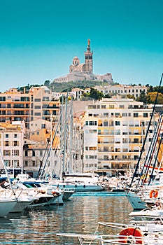 Marseille, France. Yachts Are Moored At City Pier, Jetty, Port. Catholic Basilica of Our Lady of the Guard or Notre Dame