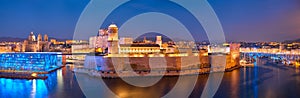 Marseille Old Port and Fort Saint-Jean in night. France