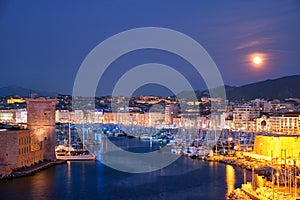 Marseille Old Port and Fort Saint-Jean in night. Marseille, France