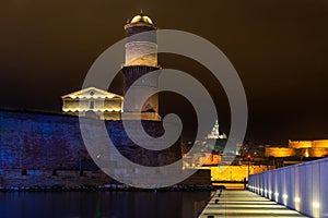 Marseille Old Port with lighthouse Fort Saint-Jean and Notre Dame de la Garde in France