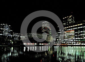 Marshall Wall View To The South Dock And The Brightly Lit Bank Towers In Canary Wharf London England At Night