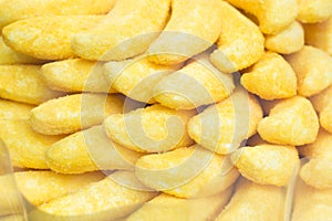 Marshmallow Bananas candies pile yellow background