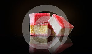 Marshmallow candy on black background. Colorful sweets candies close-up