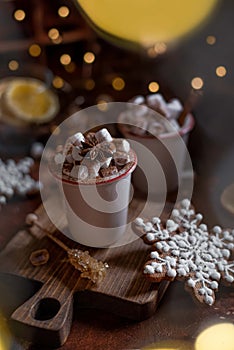 Marshmallow coffee in ceramic mugs on a concrete brown background