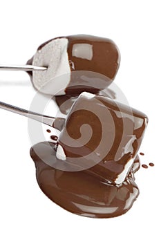 Marshmallow covered with chocolate syrup