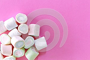 Marshmallow on pink background with copy space