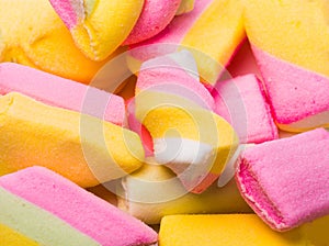 Marshmallow and souffles. Pink,white,and yellow candy. Closeup Top view