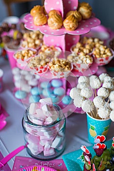 Marshmallow, sweet colored meringues, popcorn,