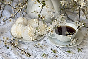 Marshmallow and tea with flowering branches