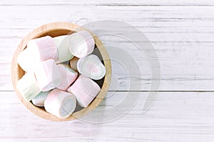 Marshmallow on wooden table with copy space