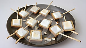 Marshmallows arranged artistically on toothpicks, creating a playful and creative display