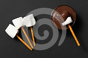 Marshmallows with chocolate in bowl photo