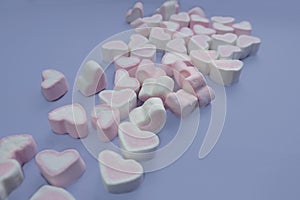 marshmallows in the shape of a heart. on a purple background (veri peri), mockup, top and side view.