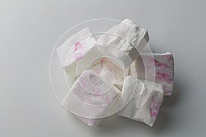 Marshmallows on white - stack of custom made white and pink marshmallow candies isolated - top view