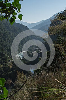 Marshyangdi river flowing through a valley close to a mounatin village