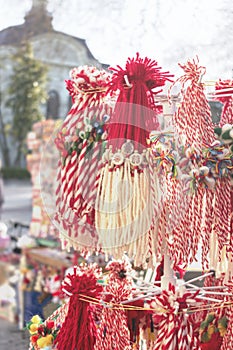 Martenitsa in the street market. Customs and traditions of Romania and Bulgaria. Selective focus, light soft effect