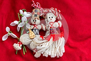 Martenitsa - traditional Bulgarian custom - red background with snowdrops