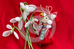 Martenitsa - traditional Bulgarian custom - red background with snowdrops