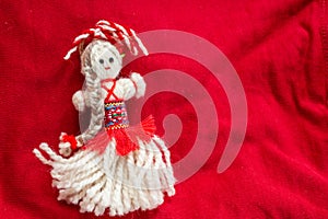 Martenitsa - traditional Bulgarian custom - red background with snowdrops