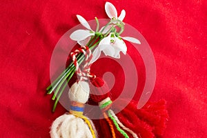 Martenitsa - traditional Bulgarian custom - red background with snowdrops