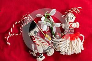 Martenitsa - traditional Bulgarian custom - red background with snowdrops