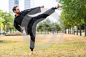 Martial artist practicing Qigong in office break