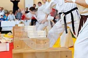 Martial artists breaks the wooden boards