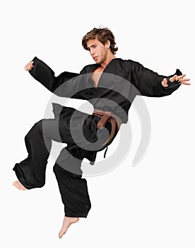 Martial arts fighter performing a jump kick