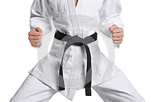 Martial arts master in keikogi with black belt on white background, closeup