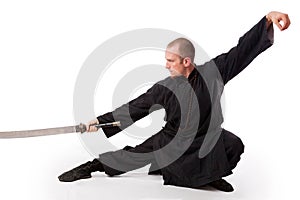 Martial arts teacher with sword out