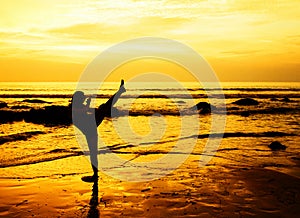 Martial arts woman on the beach