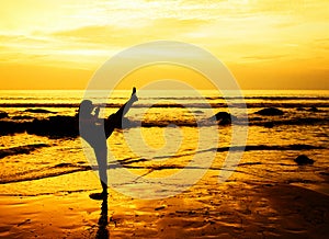 Martial arts woman on the beach photo