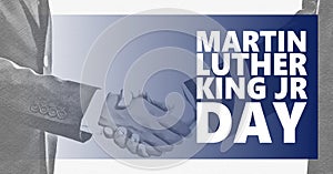 Martin Luther King jr day. White and black handshaking background