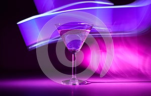 Martini cocktail drink in neon iridescent pink and blue colors.