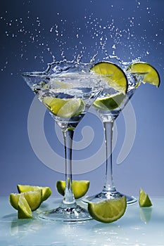 Martini cocktail with lime and splash
