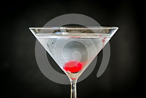 Martini cocktail with maraschino cherry