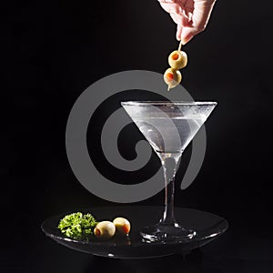 Martini drink with olives