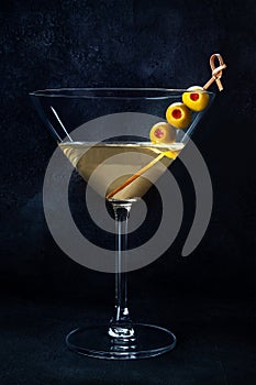 Martini. A glass of dirty martini cocktail with vermouth and olives, aperitif