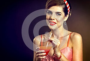 Martini glass flirt. Pin up girl drink bloody Mary cocktail.