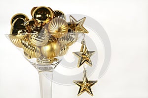 Martini glass of golden christmas ornaments